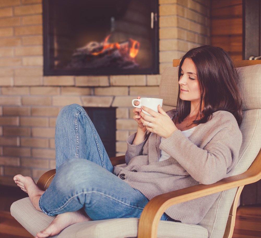 Woman by Fireplace